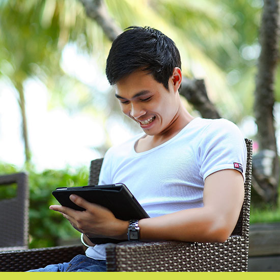 Featured image of a young male working on tablet.